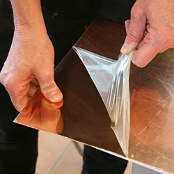 Peeling of contact paper for deep etching. The copper plate is 1 mm thick.