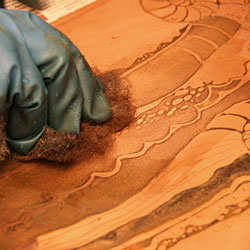 Cleaning of the etched parties with steel wool.