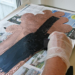 The ink is applied with a rubber filler.