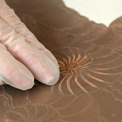 Sanding with wet sandpaper for metal.