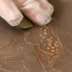 Sanding with wet sandpaper to make the surface brighter and smoother - which in the next proof will show a brighter area.