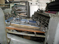 The prints are fed into the the printing-press.