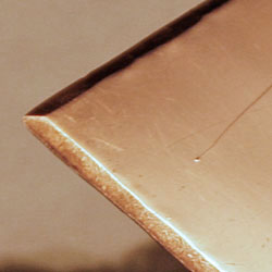 Close-up of the edge of the copper plate.