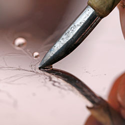 The burnisher is a soft rounded steel and is used together with a drop of water to erase - no scratch is definitive.