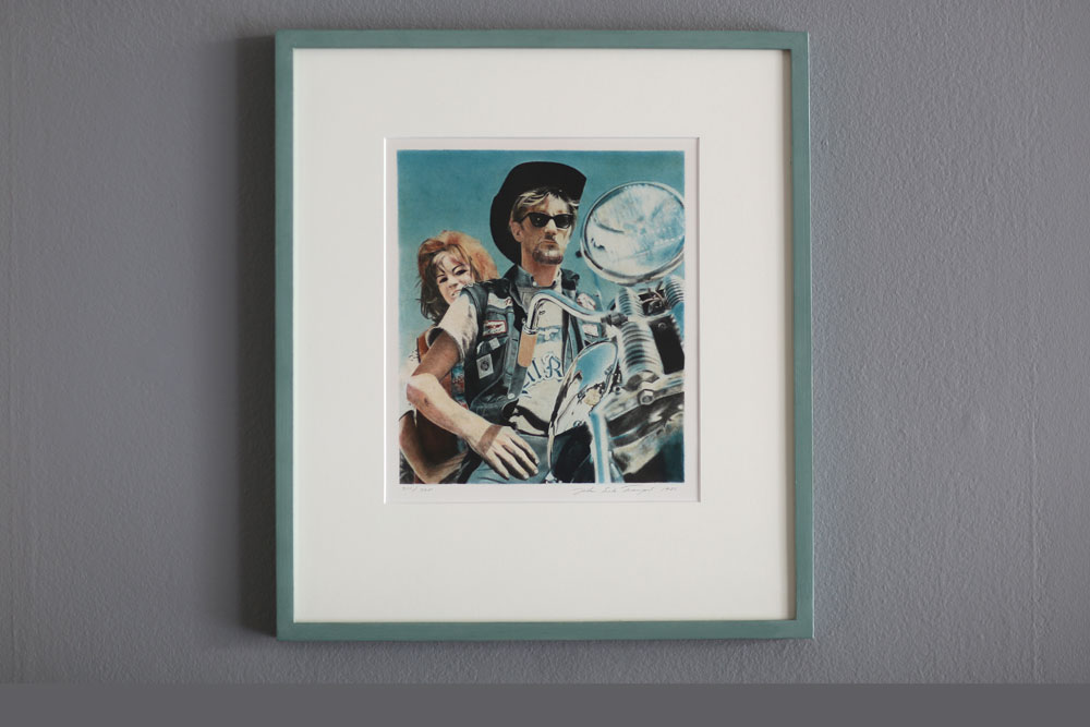 John E Franzéns litografi Ride 1982, 49x43 cm - en kvinna och en man på en motorcykel.